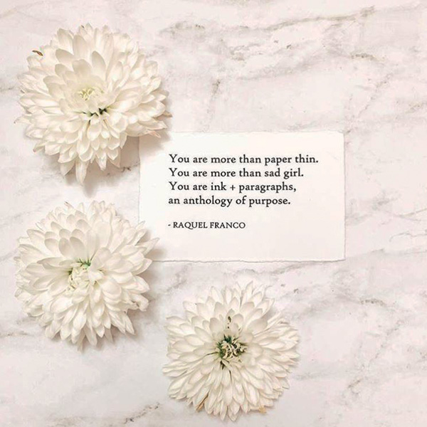 white flowers on paper with text of poem